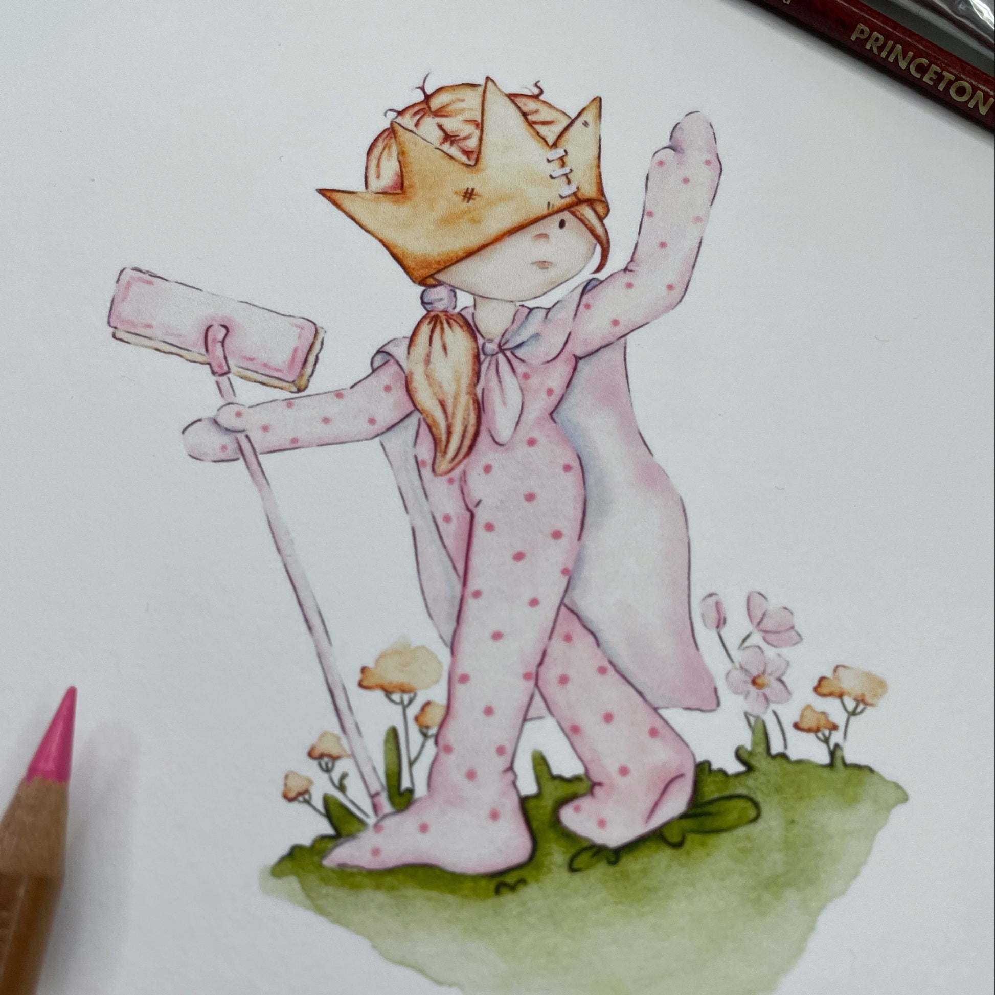 Illustration of a character in pink pajamas with a crown, holding a rolled-up paper, on a white background.